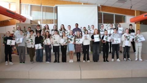 Graduating students on stage.